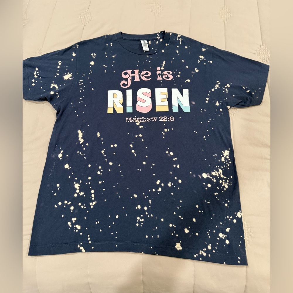 T-shirt with Christian verse “He is risen”. Navy with paint splatter design